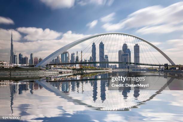 dubai skyline reflection with burj khalifa, united arab emirates - high section stock pictures, royalty-free photos & images