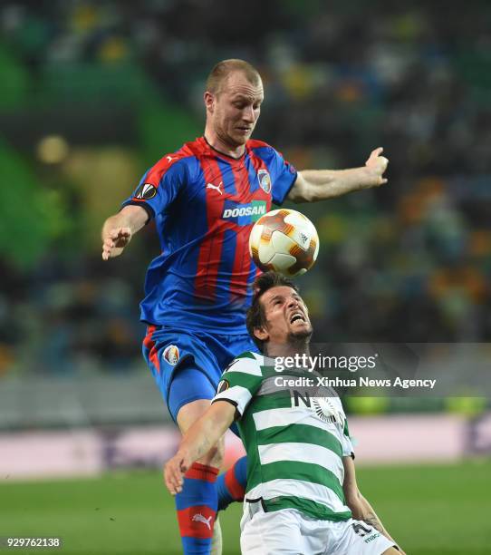 March 8, 2018 -- Fabio Coentrao of Sporting vies for the ball with Michal Krmencik of Viktoria Plzen during the UEFA Europa League round of 16 first...