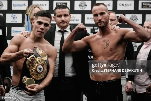 Interim champion Argentina's Brian Carlos Castano and France's Cedric Vitu pose on March 9, 2018 in Paris during the official weighing on the eve of...