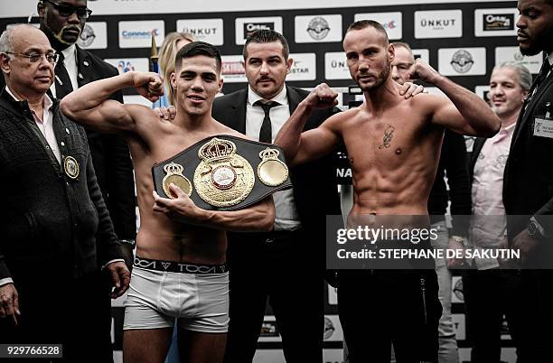 Interim champion Argentina's Brian Carlos Castano and France's Cedric Vitu pose on March 9, 2018 in Paris during the official weighing on the eve of...