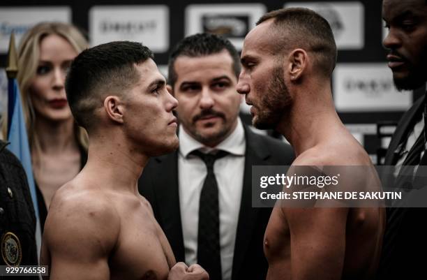 Interim champion Argentina's Brian Carlos Castano and France's Cedric Vitu pose on March 9, 2018 in Paris during the official weighing on the eve of...