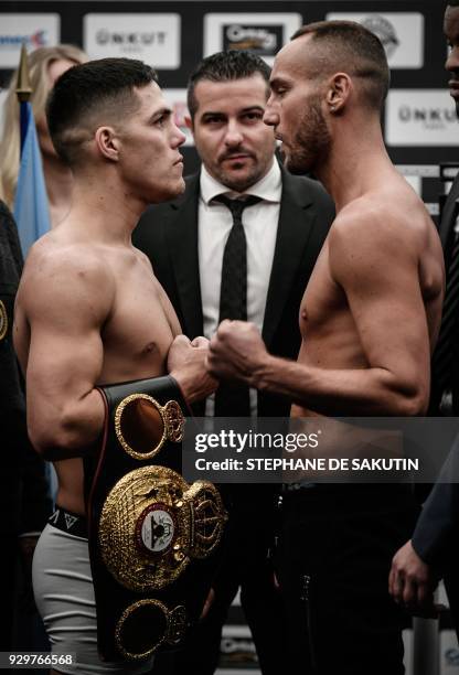 Interim champion Argentina's Brian Carlos Castano and France's Cedric Vitu pose on March 9, 2018 in Paris during the official weighing on the eve of...