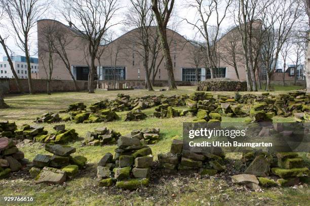 Museum Judengasse in Frankfurt/Main - memorial Neuer Boerneplatz. Grave stones on the old Jewish cementary. In the background the building of the...