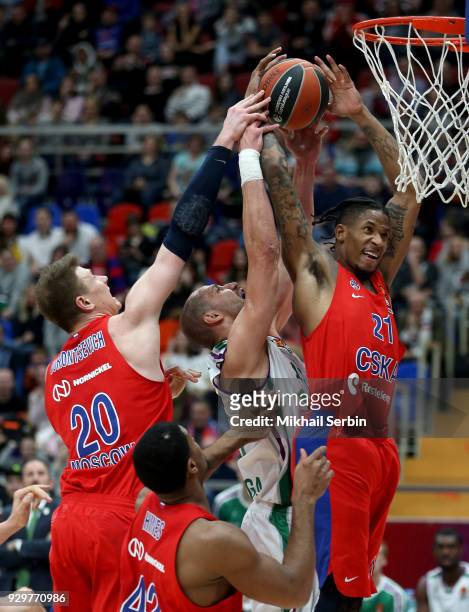 Will Clyburn, #21 and Andrey Vorontsevich, #20 of CSKA Moscow competes with James Augustine, #40 of Unicaja Malaga in action during the 2017/2018...