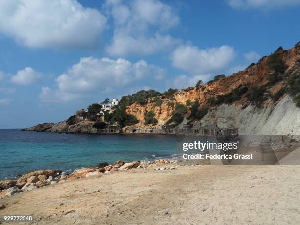 traditional boat shelters at cala d'hort, ibiza island - beach at cala d'or stock pictures, royalty-free photos & images