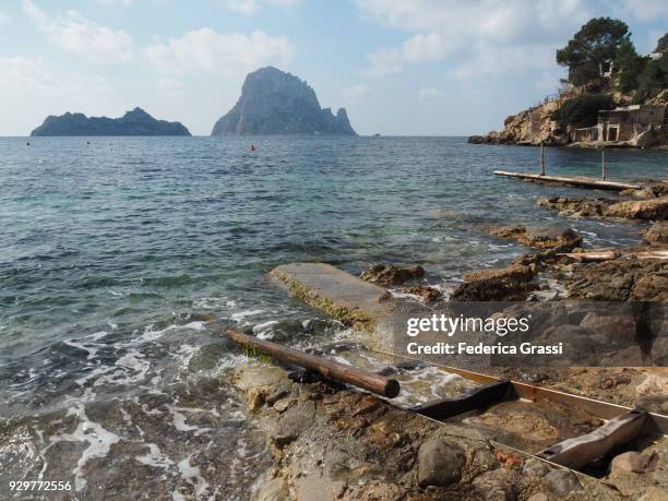 cala d'hort and es vedrà island, ibiza island - beach at cala d'or stock pictures, royalty-free photos & images