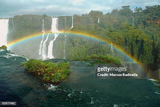 rainbow at iguazu falls - radicella stock pictures, royalty-free photos & images