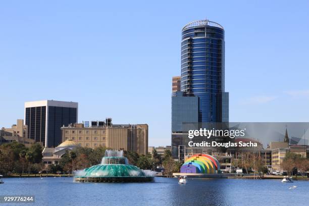 city of orlando skyline on lake eola - cleveland ohio flats stock pictures, royalty-free photos & images