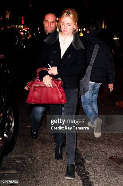 Actress Sienna Miller greets fans outside of the American Airlines Theatre on November 10, 2009 in New York City.