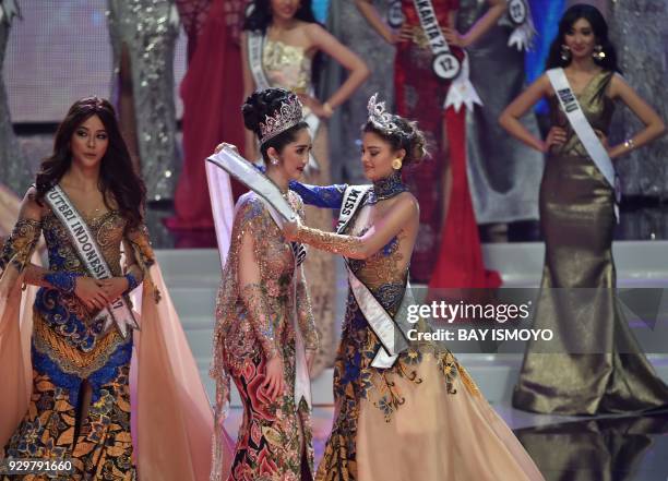 South Africa's Miss Universe Demi-Leigh Nel-Peters and Miss Indonesia 2017 Bunga Jelitha attend the crowning ceremony of Miss Indonesia 2018 Sonia...