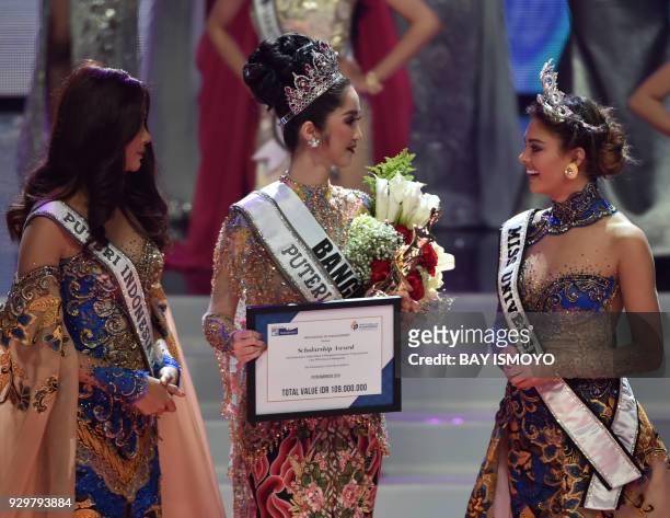 South Africa's Miss Universe Demi-Leigh Nel-Peters and Miss Indonesia 2017 Bunga Jelitha look on during the crowning ceremony of Miss Indonesia 2018...