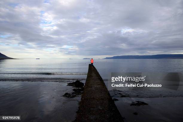 one people on the pier at saudarkrokur, north iceland - skagafjordur stock pictures, royalty-free photos & images