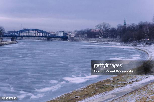 frozen wisla river in krakow, poland - cieszyn stock-fotos und bilder