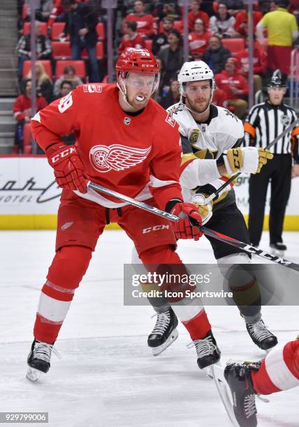 Detroit Red Wings Left Wing Anthony Mantha and Vegas Golden Knights Defenceman Colin Miller engage following a face-off in the NHL hockey game...