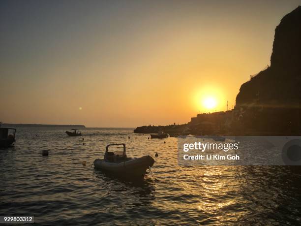 sunset from the ammoudi bay in santorini, greece - egeo stock pictures, royalty-free photos & images