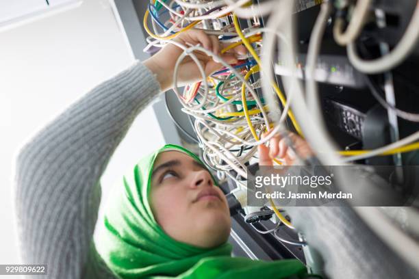 muslim girl in server room - cam girl stock pictures, royalty-free photos & images