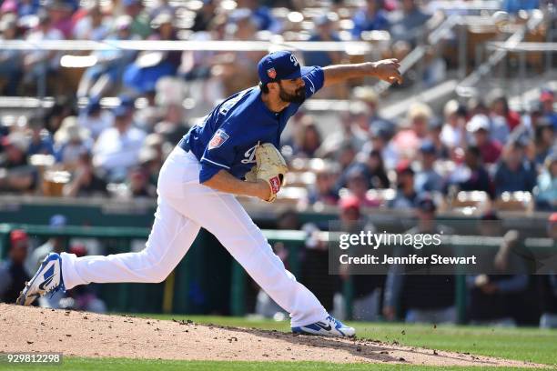 Scott Alexander of the Los Angeles Dodgers delivers a pitch in the spring training game against the Cleveland Indians at Camelback Ranch on March 1,...