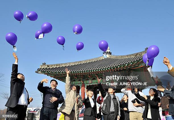 South Korean human rights activists release balloons with anti-North Korean leaflets attached at the Imjingak peace park in Paju, near the...