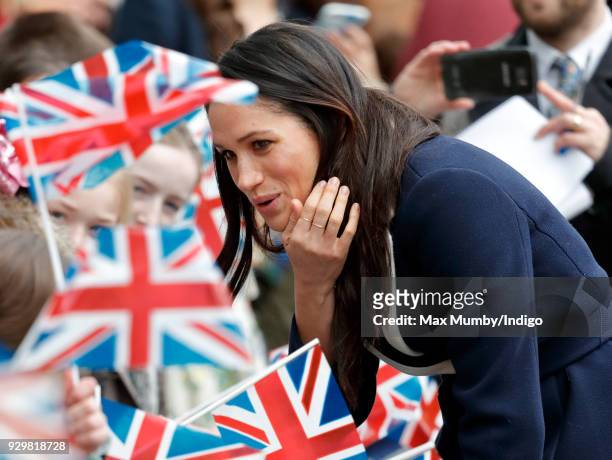 Meghan Markle meets children during a walkabout at Millennium Point before attending an event to celebrate International Women's Day on March 8, 2018...