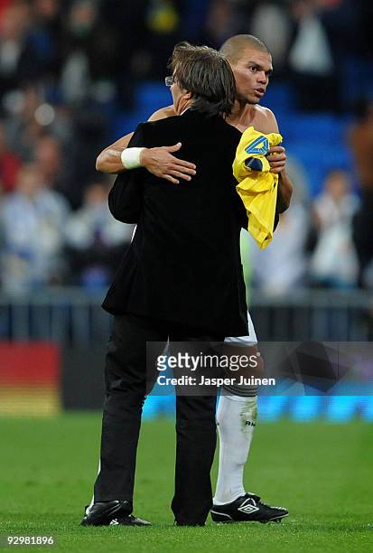 Coach Juan Antonio Anquela of AD Alcorcon greets Pepe of Real Madrid at the end of the Copa del Rey fourth round, second leg match between Real...