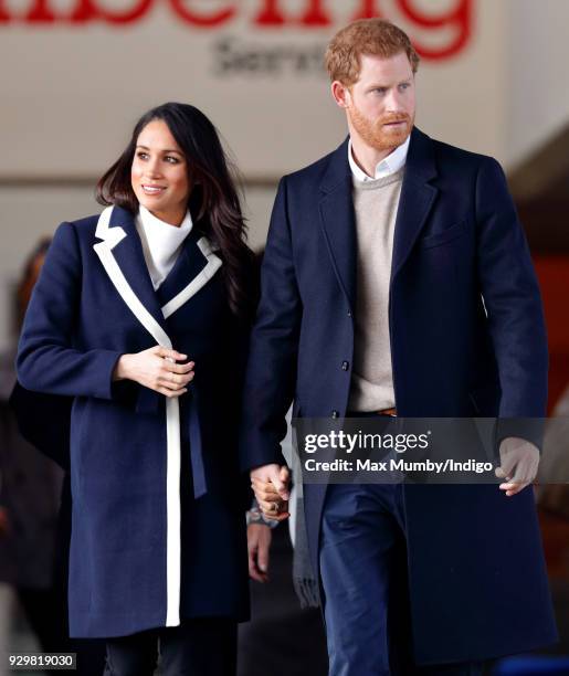 Meghan Markle and Prince Harry depart after visiting Nechells Wellbeing Centre on March 8, 2018 in Birmingham, England.