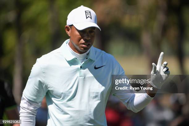 Tiger Woods acknowledges the crowd on the sixth hole during the second round of the Valspar Championship at Innisbrook Resort on March 9, 2018 in...