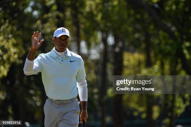 Tiger Woods acknowledges the crowd on the second green during the second round of the Valspar Championship at Innisbrook Resort on March 9, 2018 in...