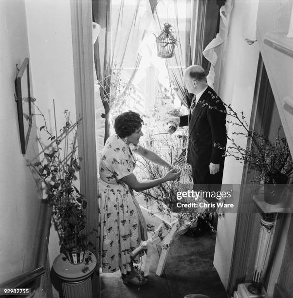 Radio and television cookery expert Fanny Cradock with her bon viveur partner Johnnie Cradock in their South Kensington home, London, 5th April 1956....