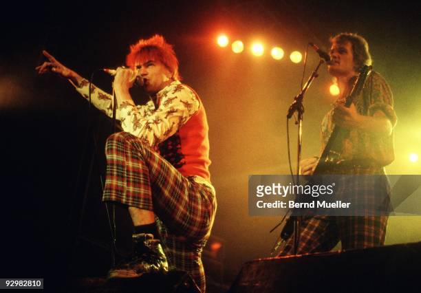 Michael Breitkopf and Campino of German punk band Die Toten Hosen perform on stage at the Jurahalle in Neumarkt, Germany in September 1990.