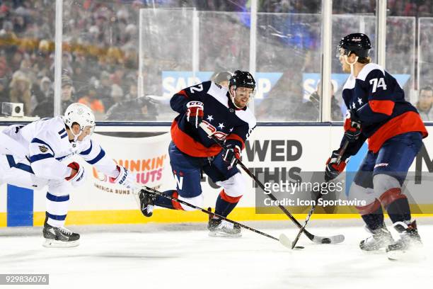 Washington Capitals center Evgeny Kuznetsov in action against Toronto Maple Leafs center Zach Hyman on March 3 at the Navy - Marine Corps Memorial...