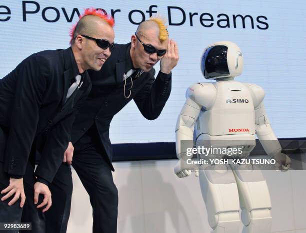 Ketch and Hiro-pon , members of the Japanese pantomime group Gamarjobat, take part in a promotional ninth birthday party for Japanese auto giant...