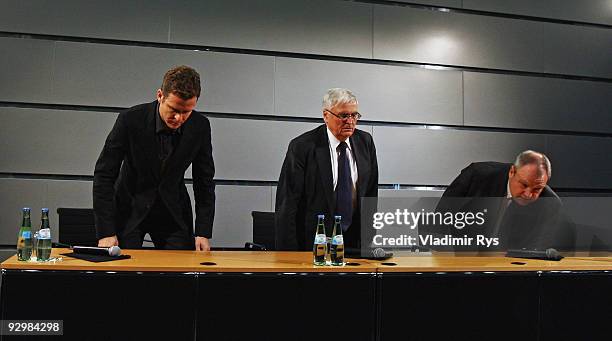 Manager Oliver Bierhoff, German Football Association president Theo Zwanziger and press officer Harald Stenger attend the press conference of the...