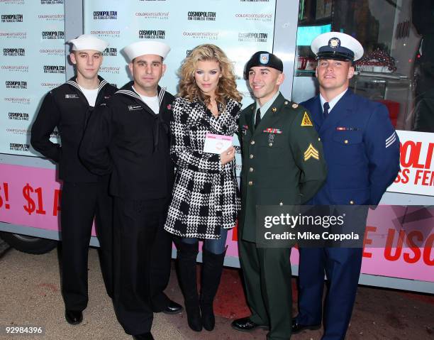 Actress AnnaLynne McCord poses with troops and collects Kisses for the Troops at Military Island, Times Square on November 11, 2009 in New York City.