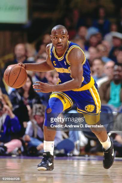 Tim Hardaway of the Golden State Warriors dribbles circa 1991 at the Great Western Forum in Inglewood, California, California. NOTE TO USER: User...