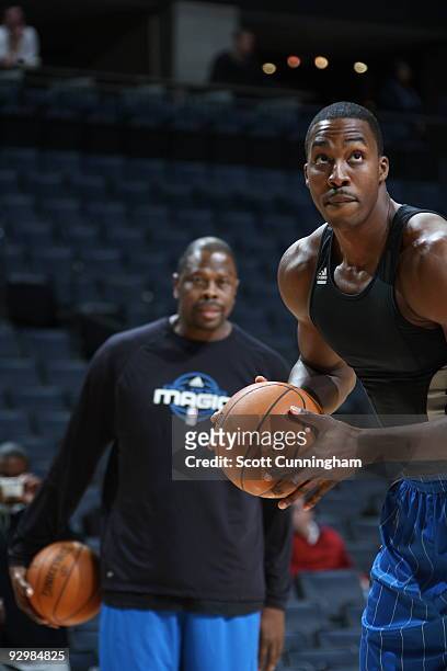 Dwight Howard of the Orlando Magic works with Assistant Coach Patrick Ewing before the game against the Charlotte Bobcats on November 10, 2009 at the...