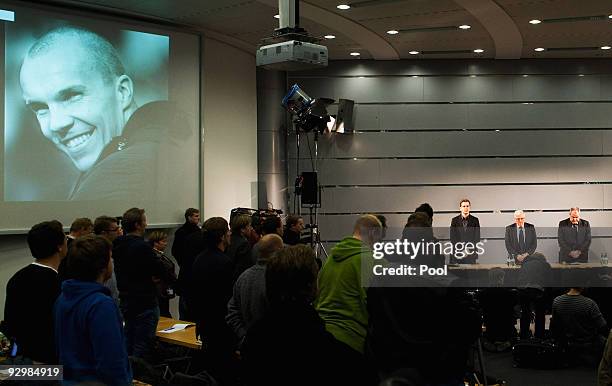 Manager Oliver Bierhoff, president Theo Zwanziger, press officer Harald Stenger and media representatives hold a minute of silence for Robert Enke...