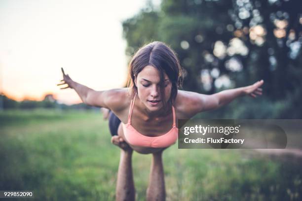 concentrating - acroyoga stock pictures, royalty-free photos & images