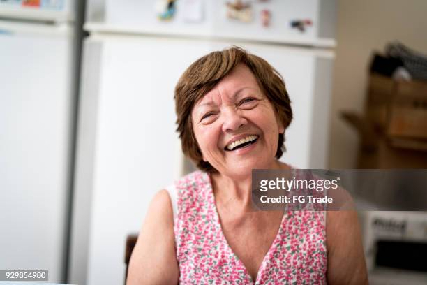 portrait of a senior woman at home - brazilian culture stock pictures, royalty-free photos & images