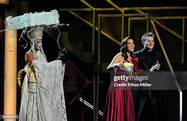 Cirque du Soleil performer stands by as singers Marlene Favela and Alexander Acha present the Best Female Pop Vocal Album awardt he 10th Annual Latin...