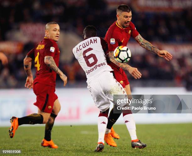 Aleksandar Kolarov of AS Roma competes for the ball with Afryie Acquah of Torino FC during the Serie A match between AS Roma and Torino FC at Stadio...