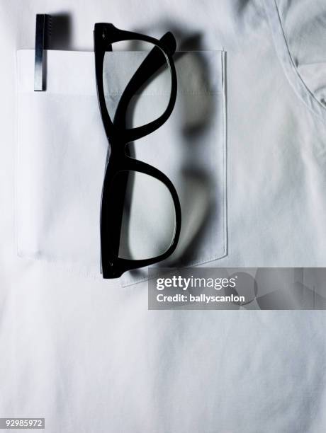 glasses and pen in white shirt pocket. - dicke-brillenfassung stock-fotos und bilder