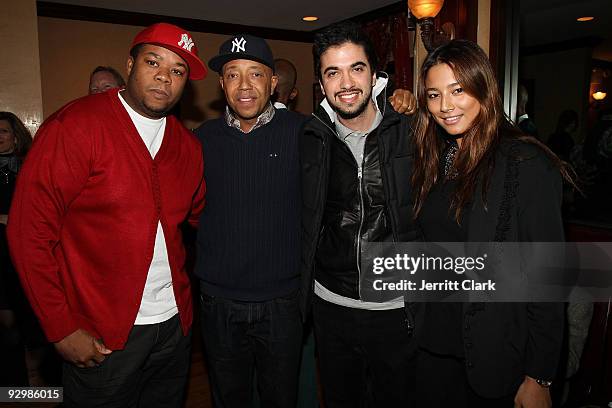 Josue Sejour, Russell Simmons, DJ Cassidy and Jessica Gomes attend the 2009 Life Project for Africa benefit at Ben and Jack's Restaurant on November...