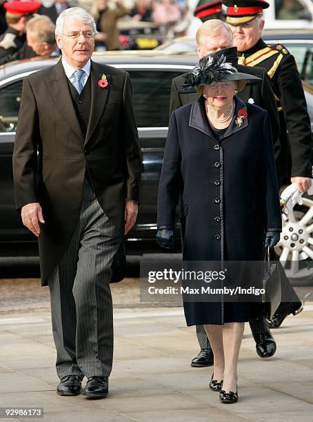 Sir John Major and Baroness Margaret Thatcher attend the Armistice Day service at Westminster Abbey on November 11, 2009 in London, England. The...