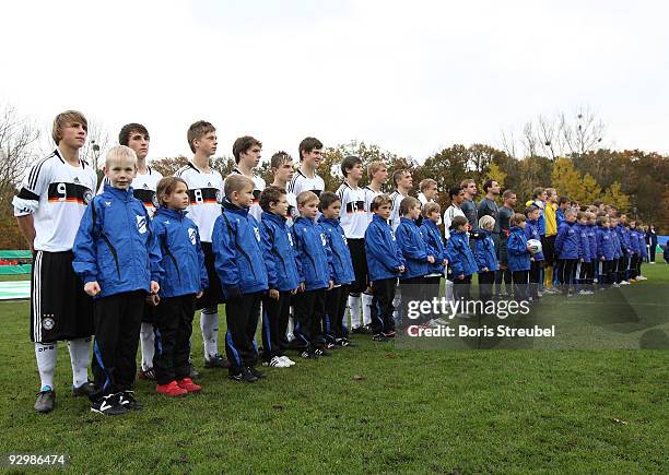 Players of Germany and Estland line up prior to the U15 International Friendly Match between Germany and Estland at the 'Mueritz Stadion' on November...
