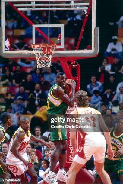 Shawn Kemp of the Seattle SuperSonics rebounds during a game on February 23, 1994 at the Omni in Atlanta, Georgia. NOTE TO USER: User expressly...