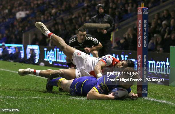 Warrington Wolves Harvey Livett scores his sides second try of the game against St Helens during the Betfred Super League match at The Halliwell...