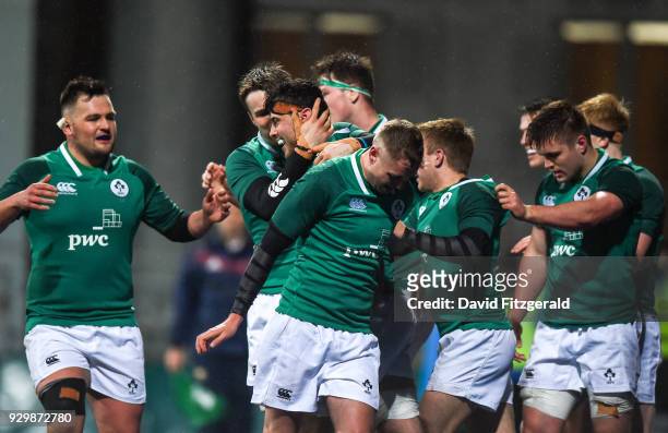 Dublin , Ireland - 9 March 2018; Jack O'Sullivan of Ireland is congratulated by team mates after scoring his side's fourth try during the U20 Six...