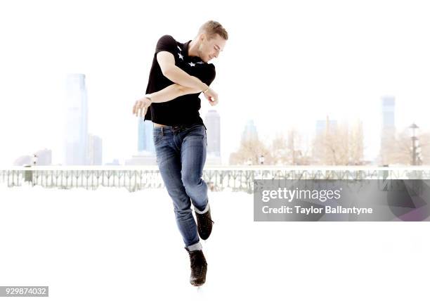 Portrait of Team USA Adam Rippon posing on the ice during photo shoot at The Rink at Brookfield Place. Rippon won a bronze medal in the Team event at...