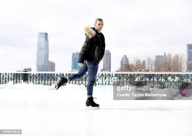 Portrait of Team USA Adam Rippon posing on the ice during photo shoot at The Rink at Brookfield Place. Rippon won a bronze medal in the Team event at...