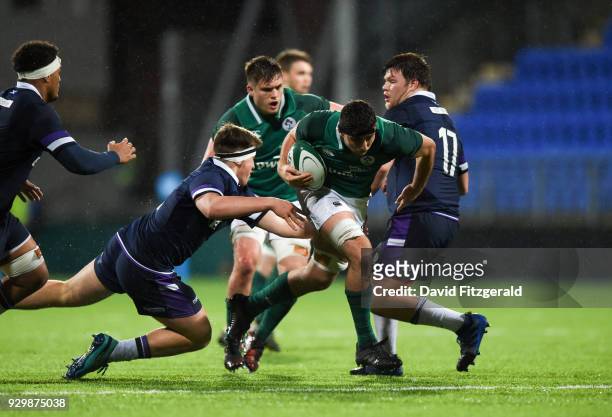 Dublin , Ireland - 9 March 2018; Jack O'Sullivan of Ireland breaks the tackle of Bradley Clements of Scotland on his way to scoring his side's fourth...